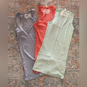 All Saints tank tops. Size 10. Colours blue, coral, and green.